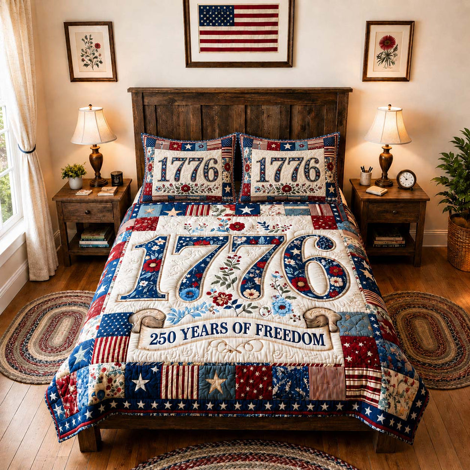 1776 America Freedom quilted bedding set, quilt and two pillow shams on a made bed