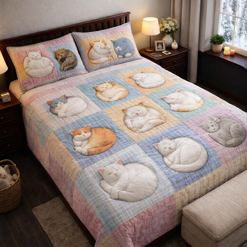 Adorable Cats Pastel Sleeping Curls quilted bedding set, quilt and two pillow shams on a made bed