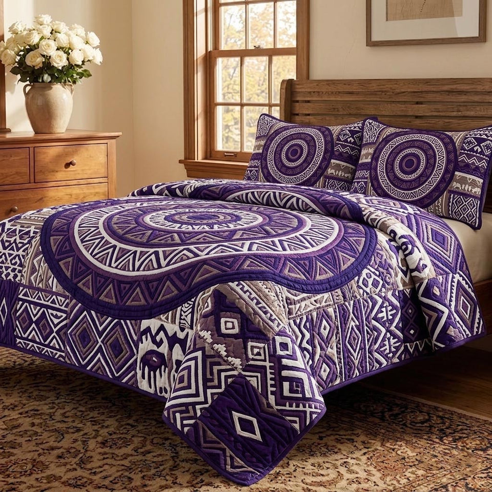 African Heritage Violet Zigzag Medallion quilted bedding set, quilt and two pillow shams on a made bed