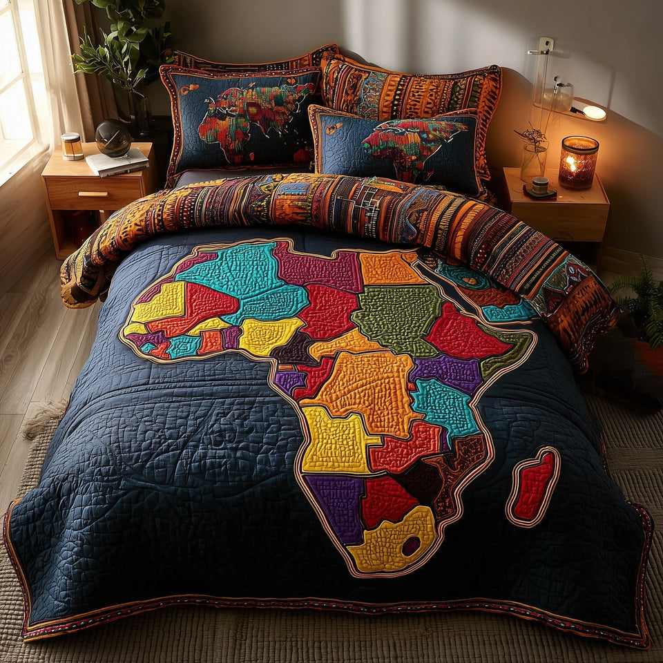 African Roots Color Block Map on Navy quilted bedding set, quilt and two pillow shams on a made bed