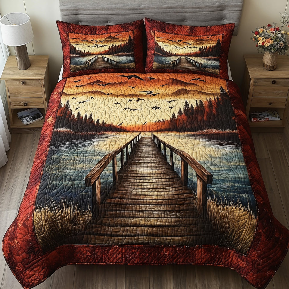 Amber Sky Driftwood Walk quilted bedding set, quilt and two pillow shams on a made bed