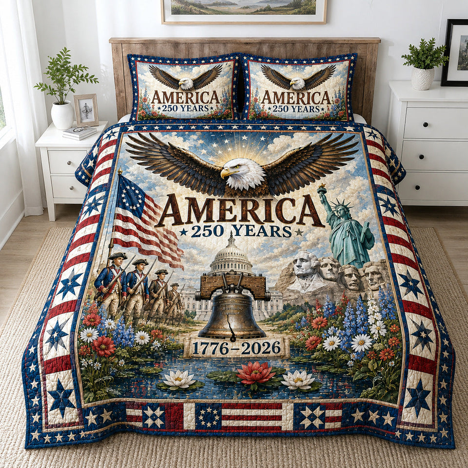 America 250 Bell Eagle quilted bedding set, quilt and two pillow shams on a made bed
