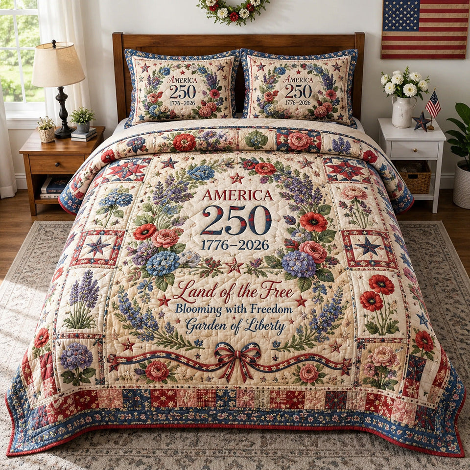 America 250 Floral Wreath on Cream quilted bedding set, quilt and two pillow shams on a made bed