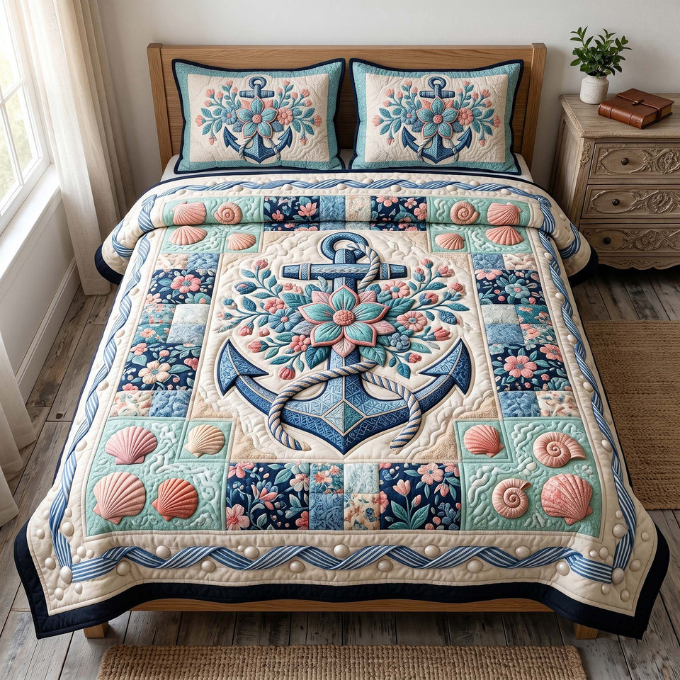 Anchor Breeze Coral Blooms And Black Trim quilted bedding set, quilt and two pillow shams on a made bed