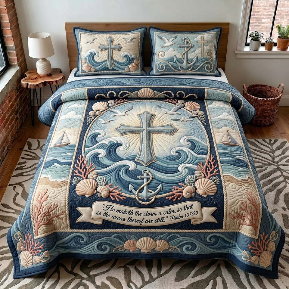 Anchor Cross quilted bedding set, quilt and two pillow shams on a made bed