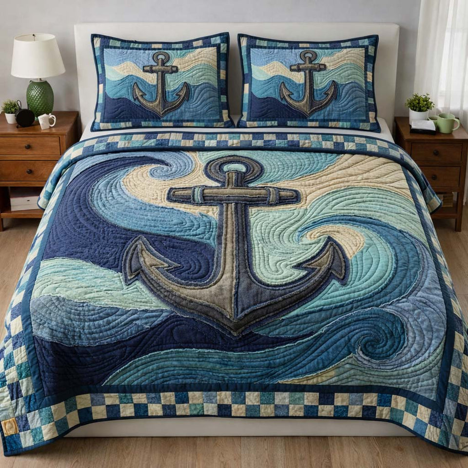 Anchor Swirl Ocean Waves quilted bedding set, quilt and two pillow shams on a made bed