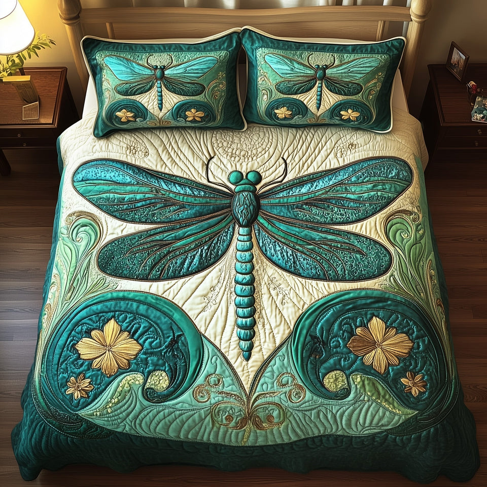 Art Nouveau Dragonfly quilted bedding set, quilt and two pillow shams on a made bed