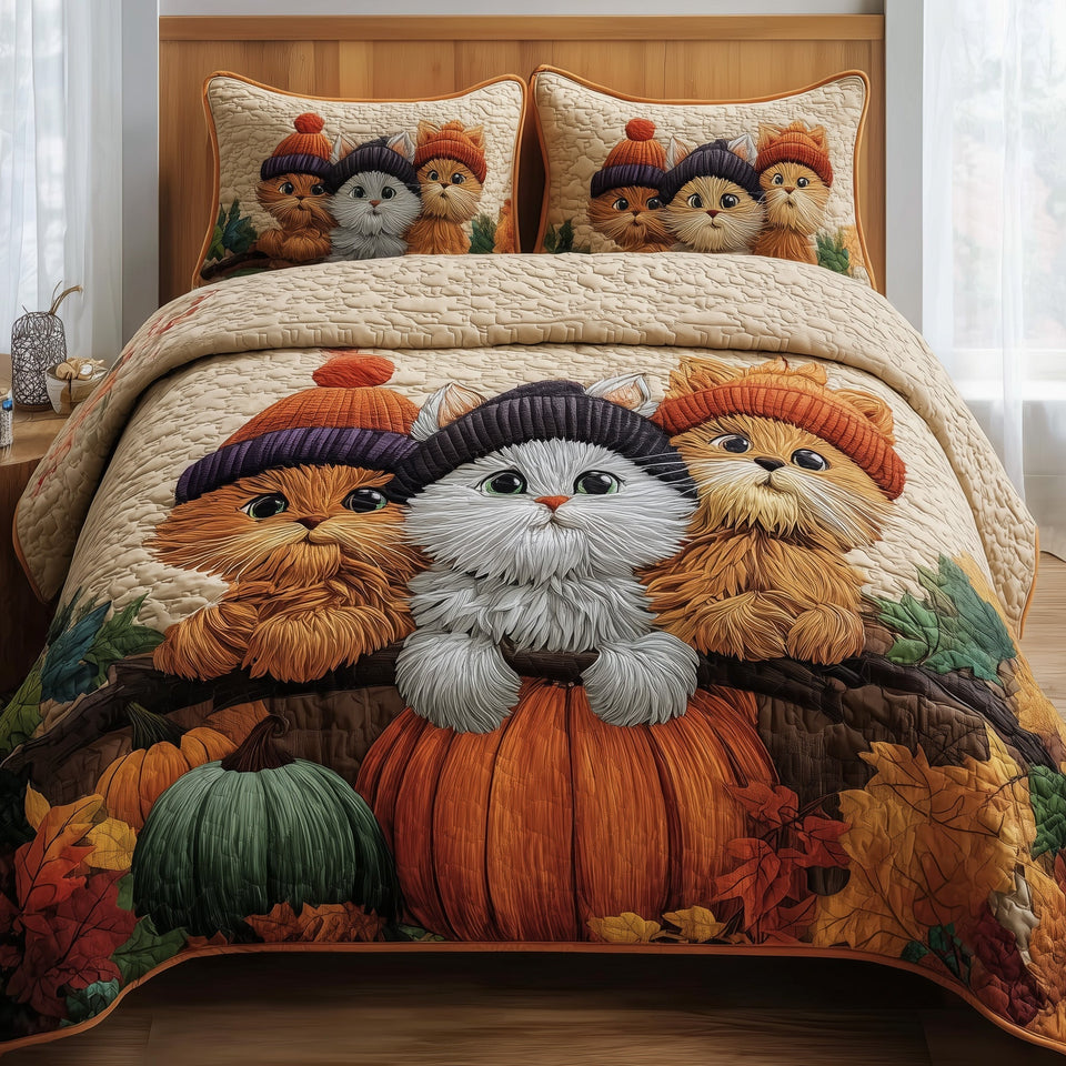 Autumn Cat Cottage Trio quilted bedding set, quilt and two pillow shams on a made bed