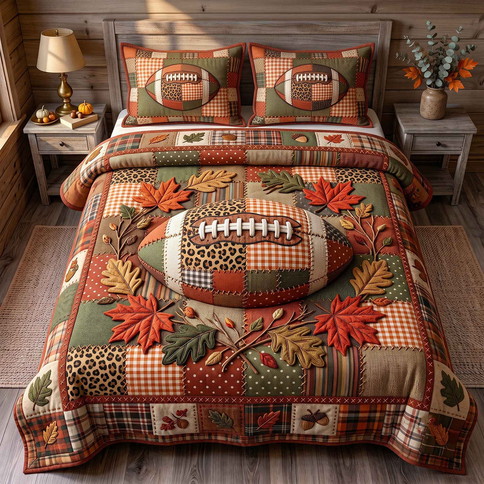 Autumn Gridiron Football on a Bed of Maple Leaves quilted bedding set, quilt and two pillow shams on a made bed