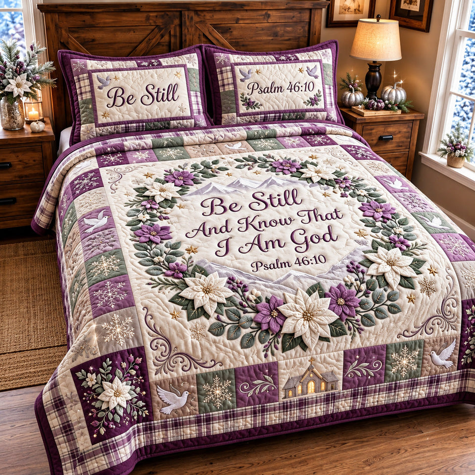 Be Still Faith quilted bedding set, quilt and two pillow shams on a made bed