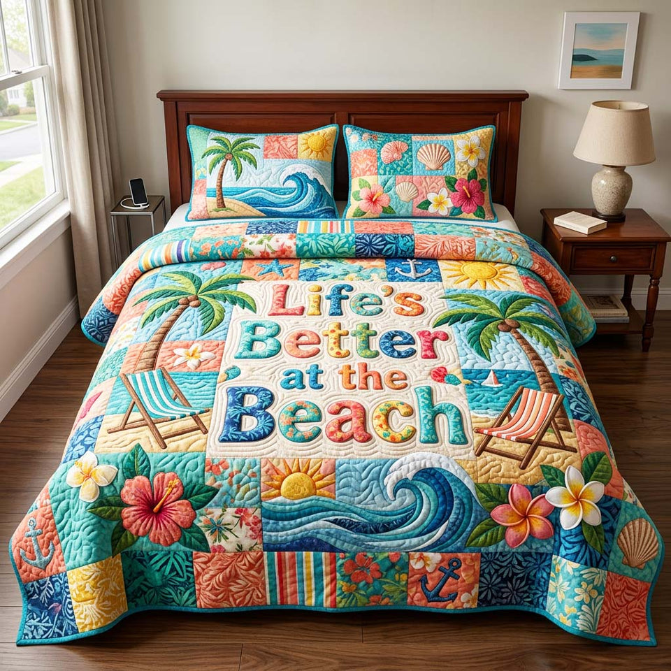 Beach Patchwork quilted bedding set, quilt and two pillow shams on a made bed