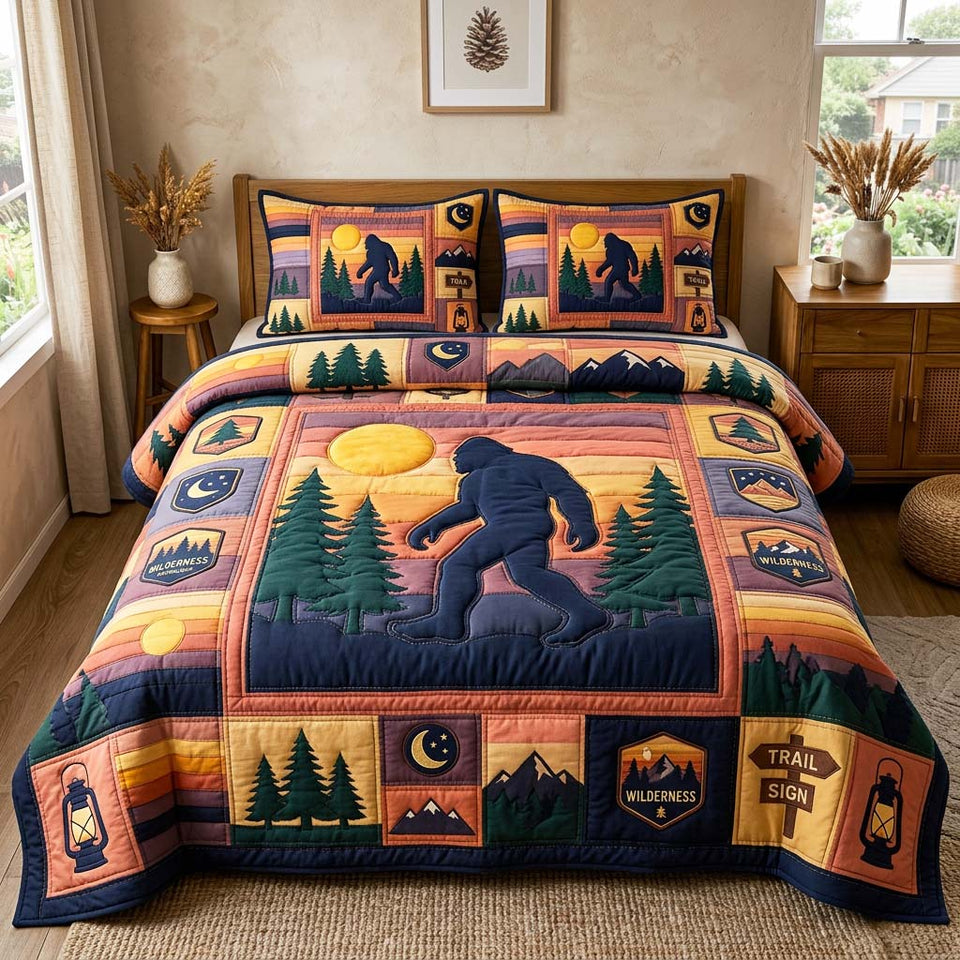 Bigfoot Sunset Trail Panels quilted bedding set, quilt and two pillow shams on a made bed