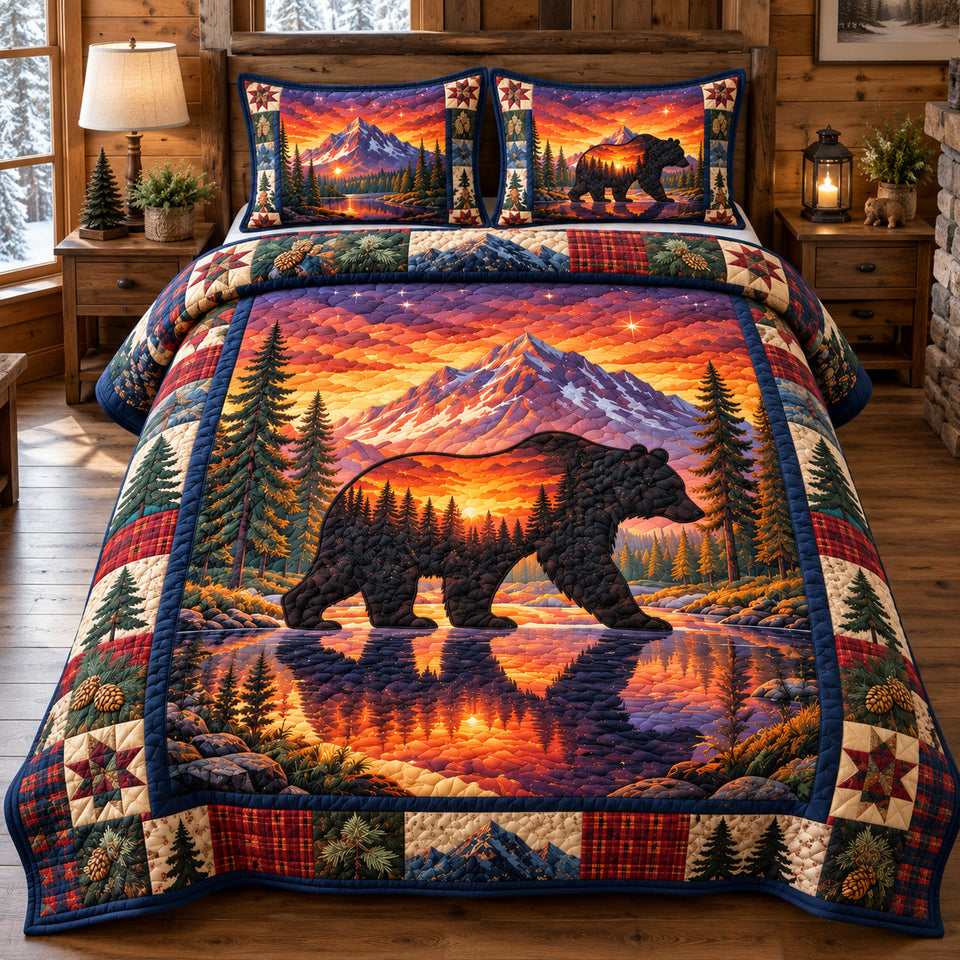 Black Bear Mountain Sunset quilted bedding set, quilt and two pillow shams on a made bed
