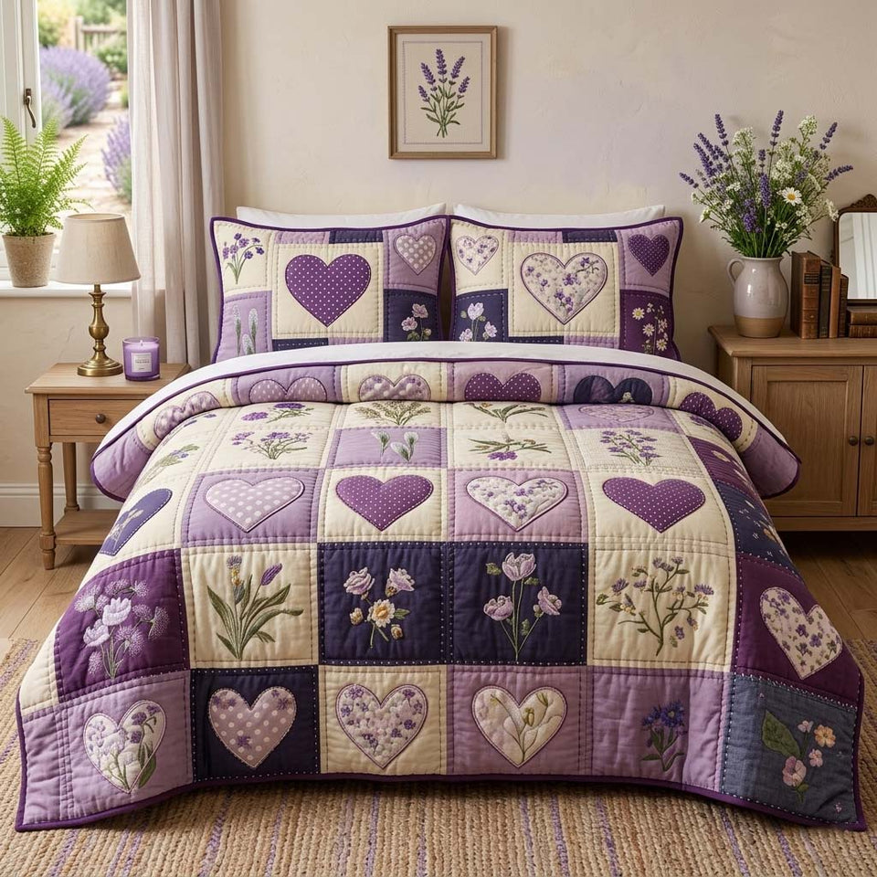 Blossom Patchwork Lavender Hearts And Flower Sprigs quilted bedding set, quilt and two pillow shams on a made bed