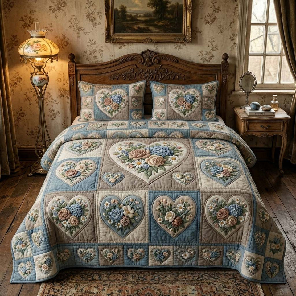 Blue Blossom Garden quilted bedding set, quilt and two pillow shams on a made bed