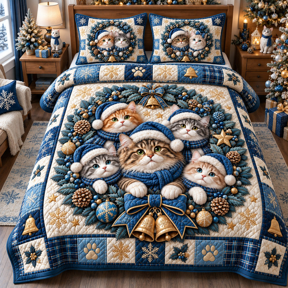 Blue Christmas Cat Wreath quilted bedding set, quilt and two pillow shams on a made bed