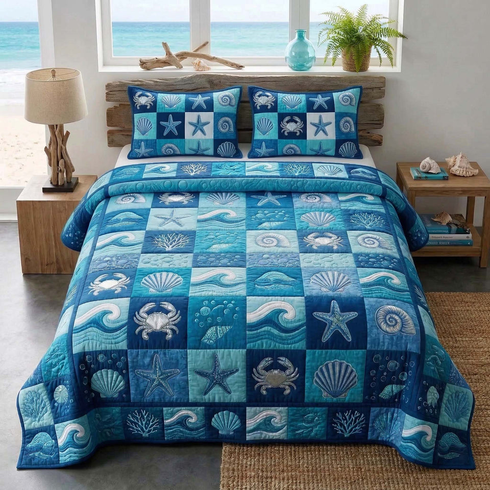Blue Patchwork quilted bedding set, quilt and two pillow shams on a made bed