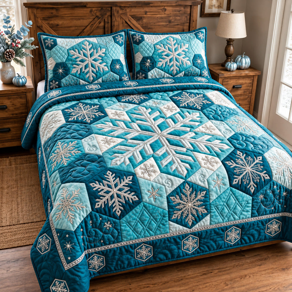 Blue Snowflake quilted bedding set, quilt and two pillow shams on a made bed