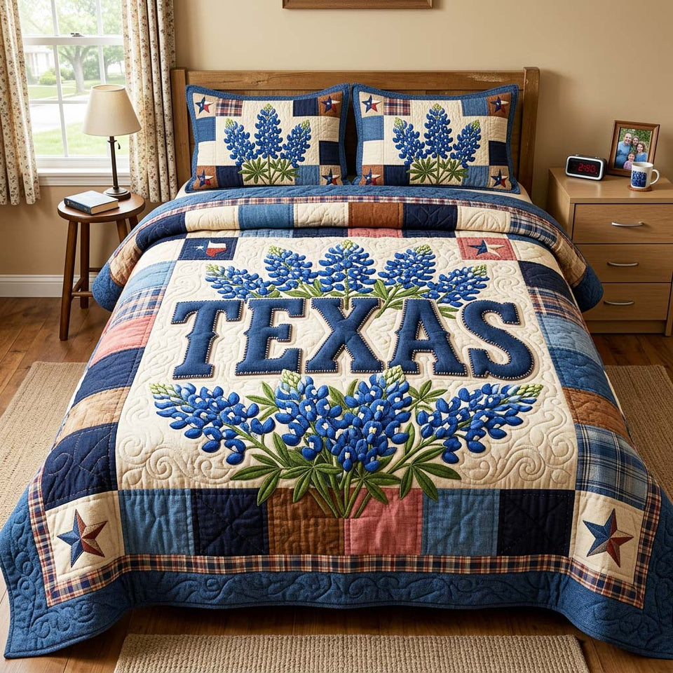 Bluebonnet Texas quilted bedding set, quilt and two pillow shams on a made bed