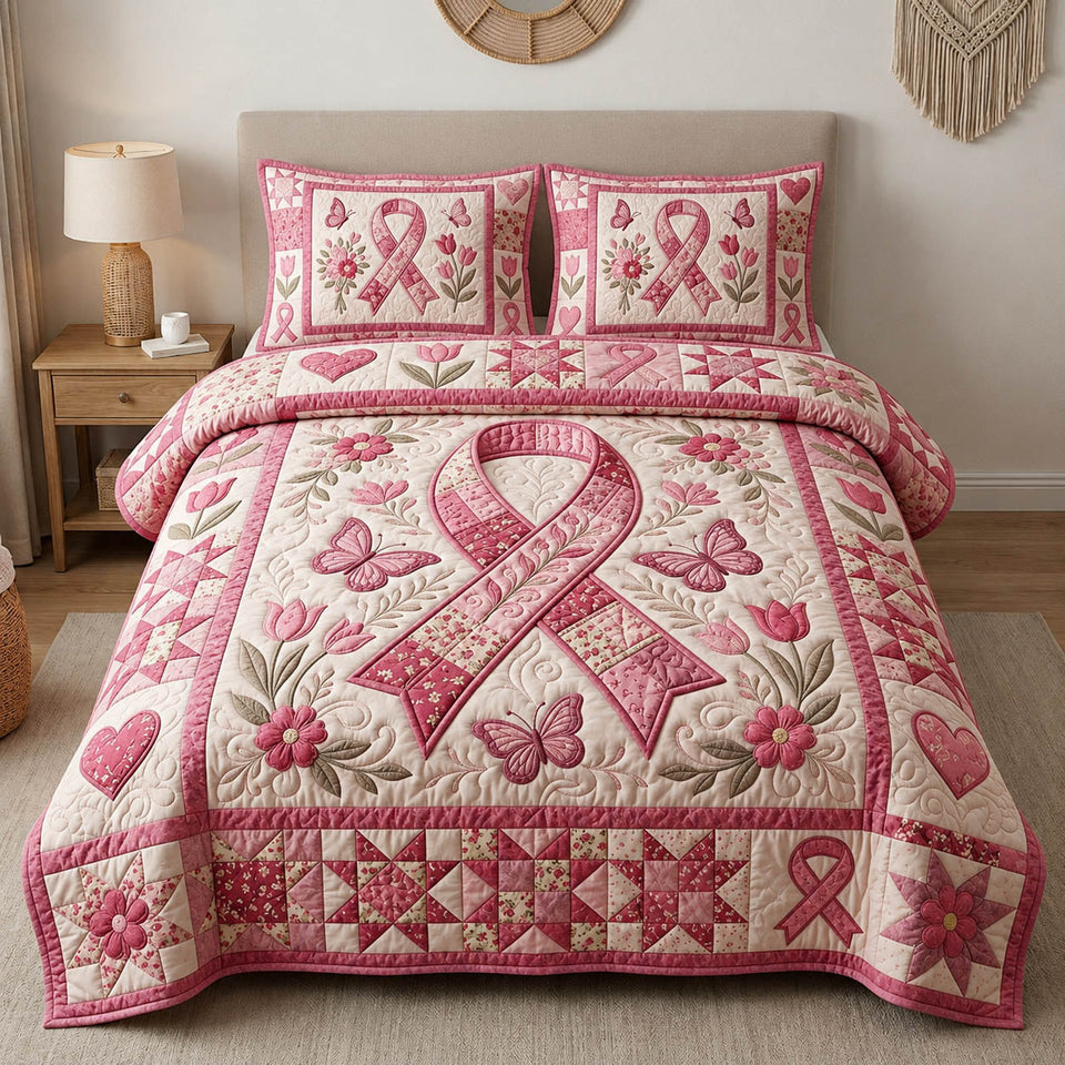 Breast Cancer Large Ribbon with Butterflies quilted bedding set, quilt and two pillow shams on a made bed