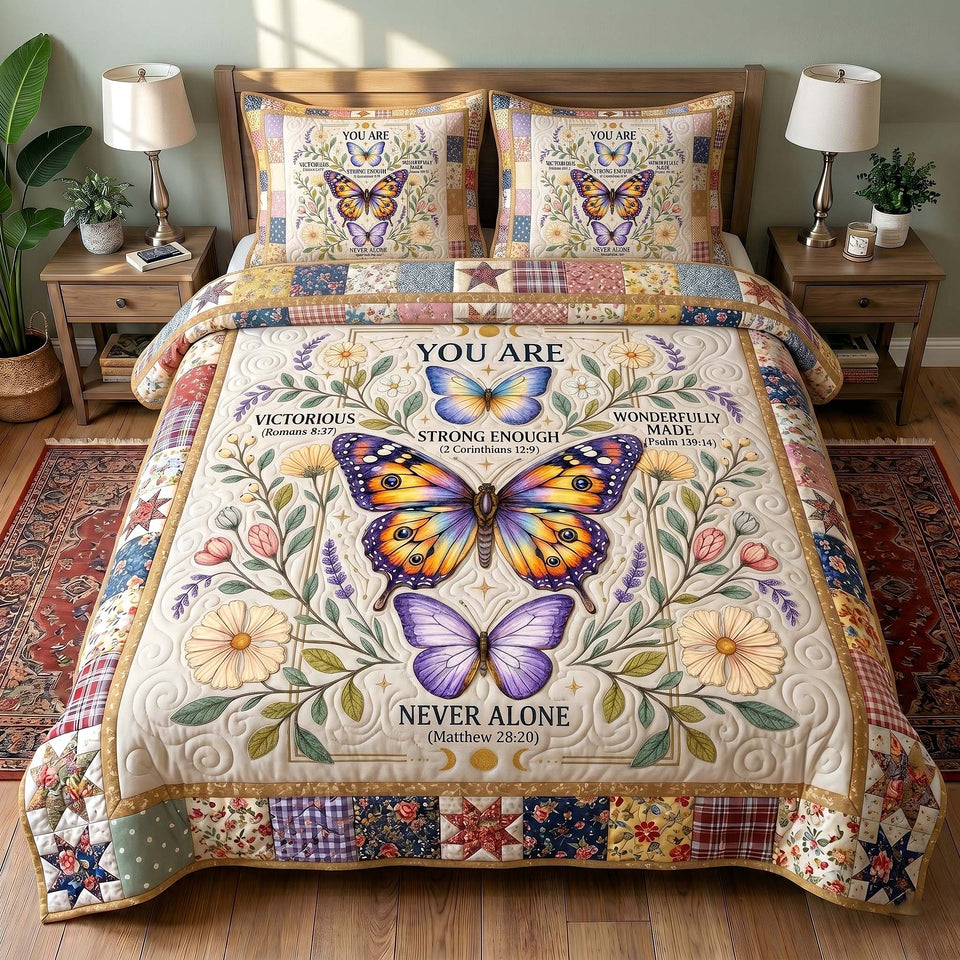 Butterfly Never Alone quilted bedding set, quilt and two pillow shams on a made bed