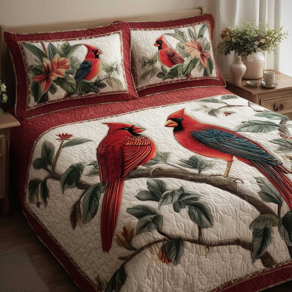 Cardinal Pair Berry Branch quilted bedding set, quilt and two pillow shams on a made bed