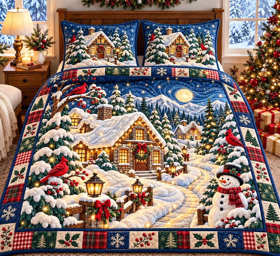 Cardinal Snow Cottage quilted bedding set, quilt and two pillow shams on a made bed