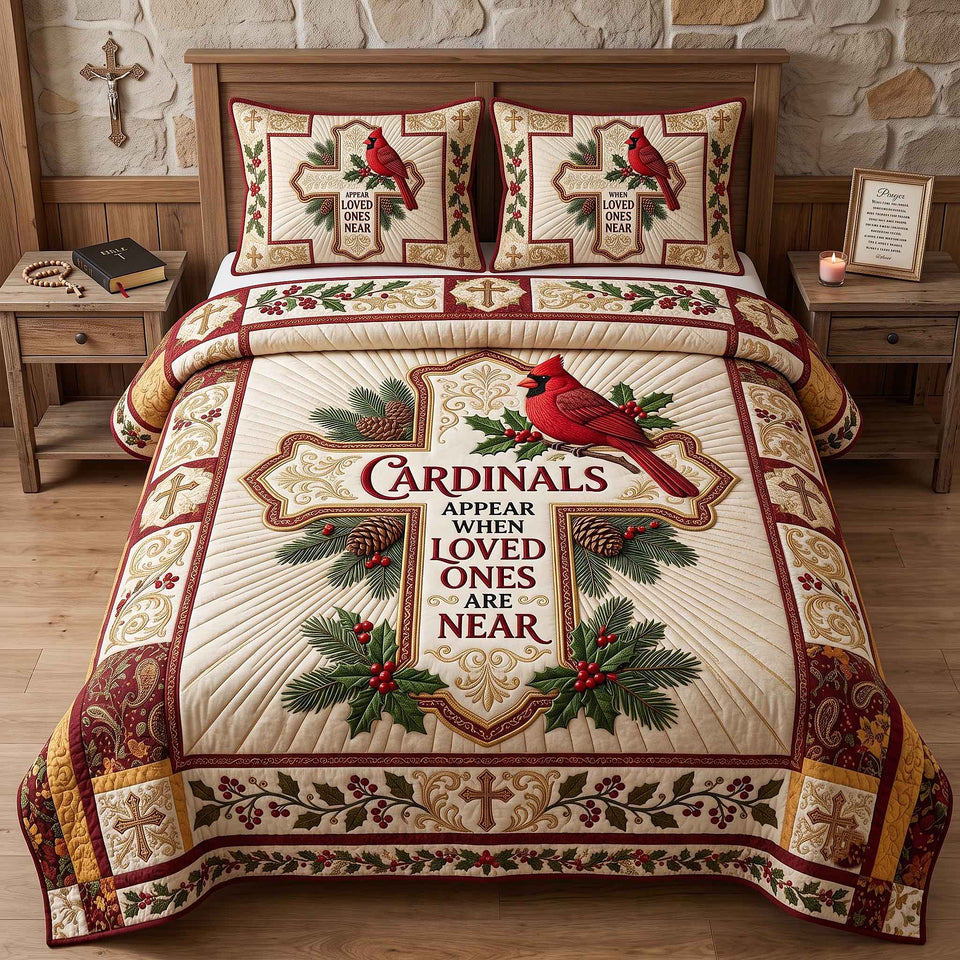 Cardinals Appear Memorial quilted bedding set, quilt and two pillow shams on a made bed