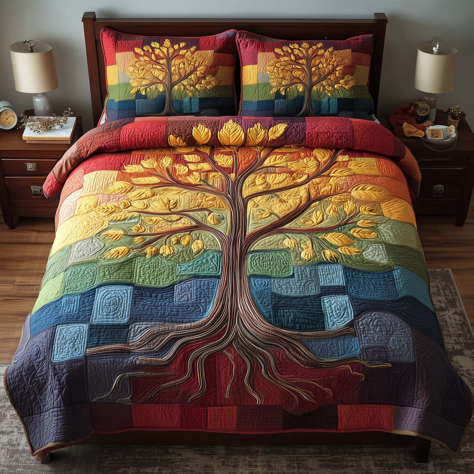 Celestial Tree Rainbow Patchwork quilted bedding set, quilt and two pillow shams on a made bed