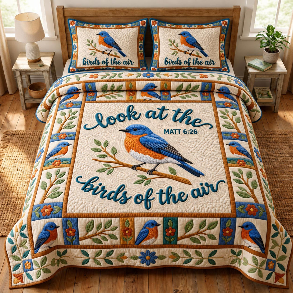 Christian Bird Single Bluebird Perch quilted bedding set, quilt and two pillow shams on a made bed