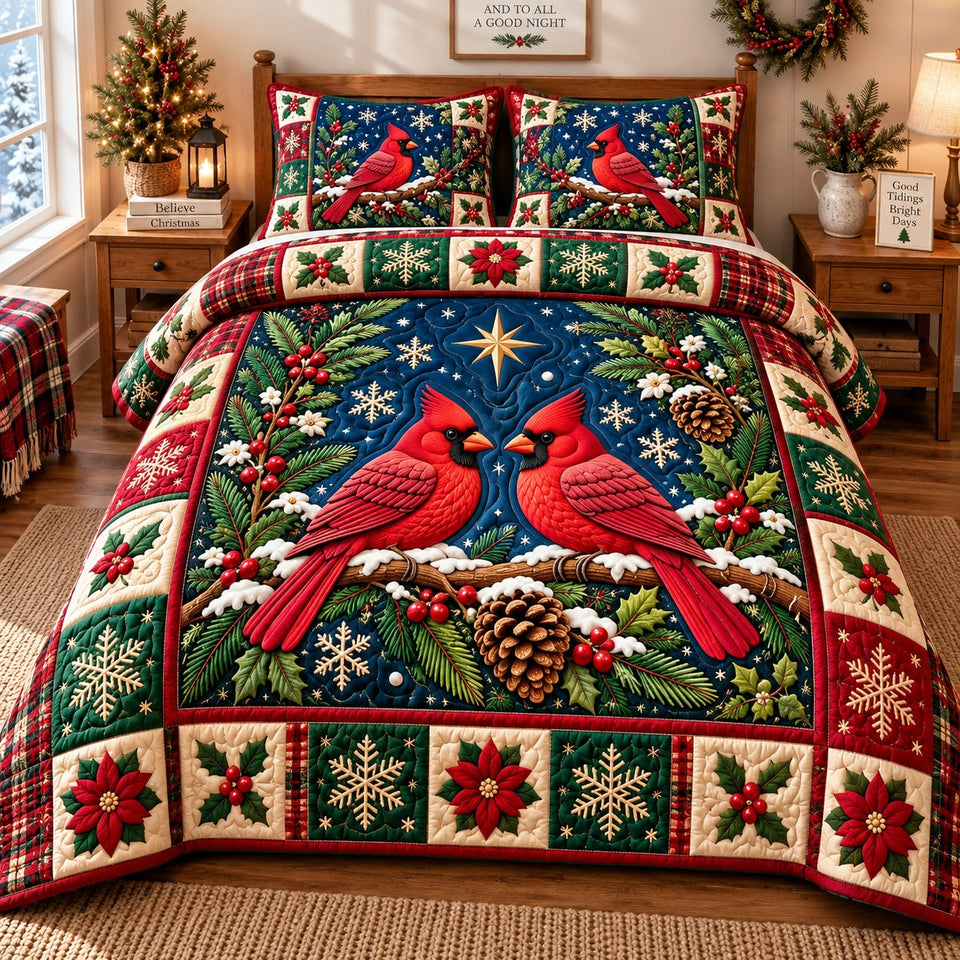 Christmas Cardinal Dreams quilted bedding set, quilt and two pillow shams on a made bed