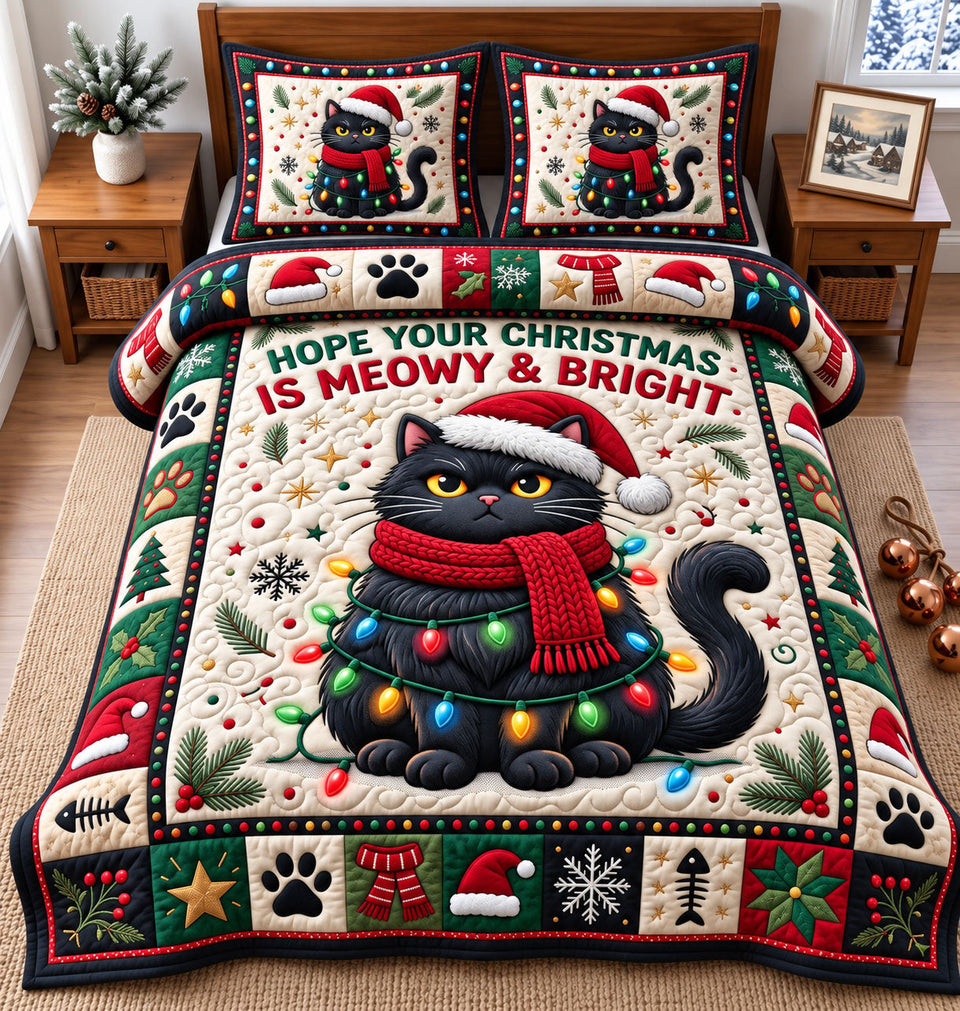 Christmas Cat in Charcoal quilted bedding set, quilt and two pillow shams on a made bed