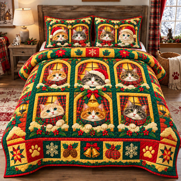 Christmas Cats At The Window quilted bedding set, quilt and two pillow shams on a made bed