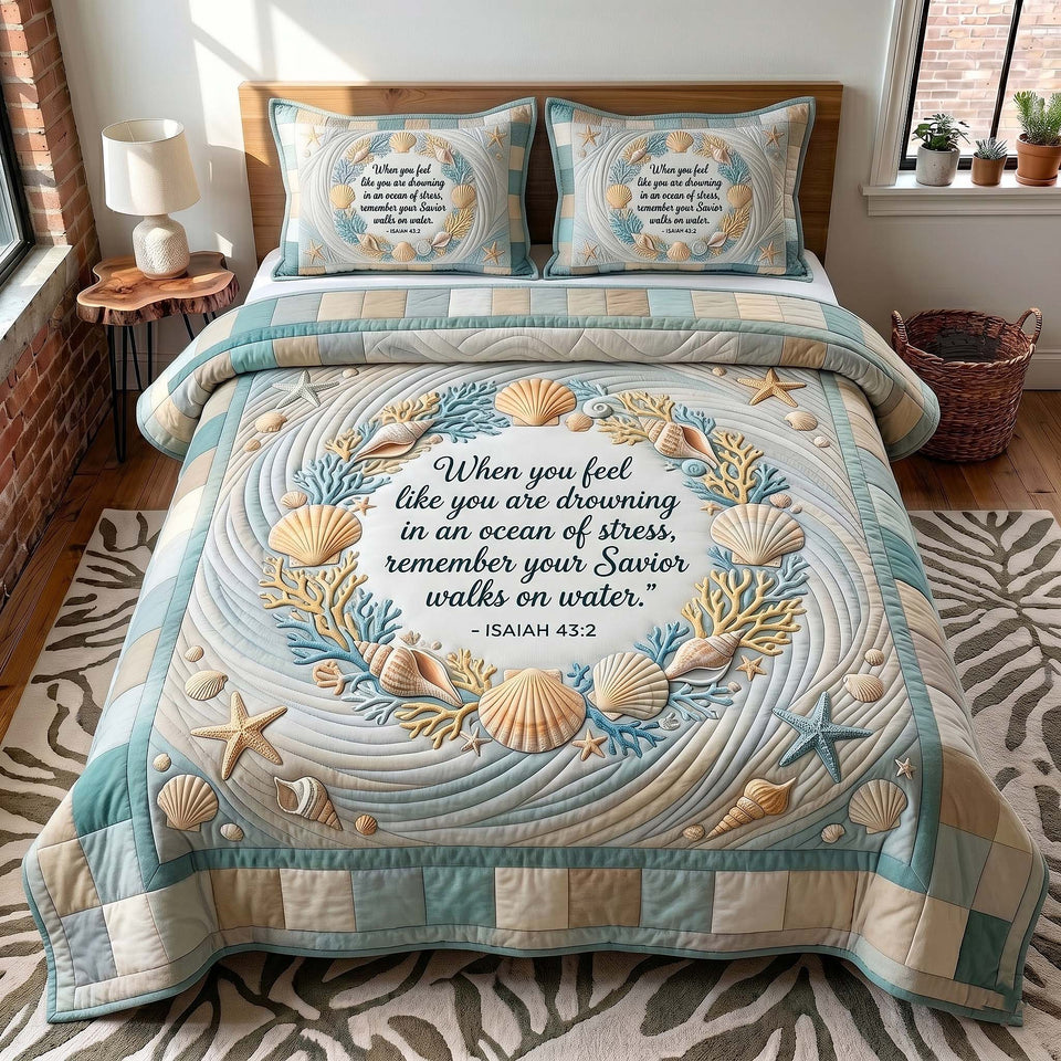 Coastal Blessings Seashell Wreath Pale Sand quilted bedding set, quilt and two pillow shams on a made bed