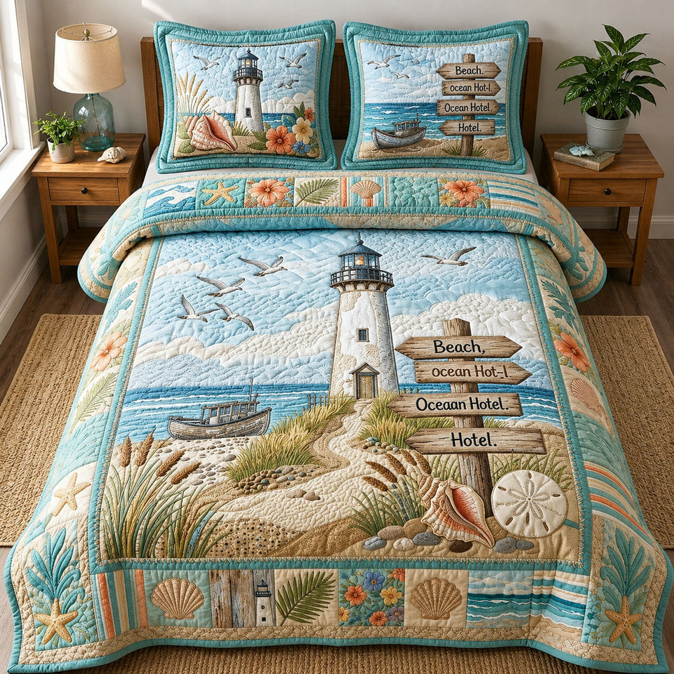 Coastal Life Lighthouse quilted bedding set, quilt and two pillow shams on a made bed