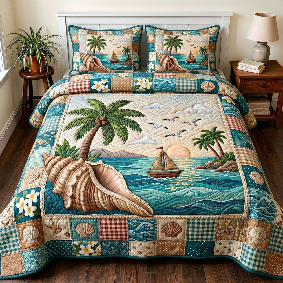 Coastal Serenity Conch Palm and Sailboat quilted bedding set, quilt and two pillow shams on a made bed
