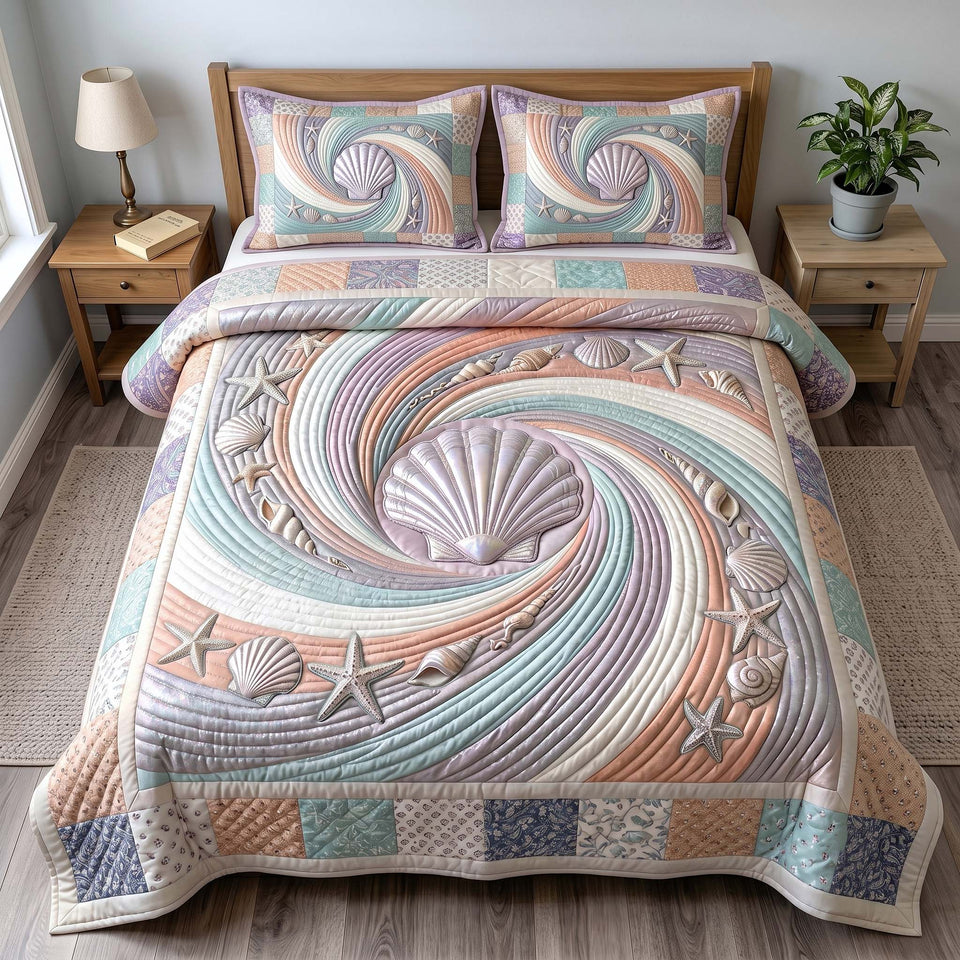 Coastal Whisper Blush Spiral Shell quilted bedding set, quilt and two pillow shams on a made bed