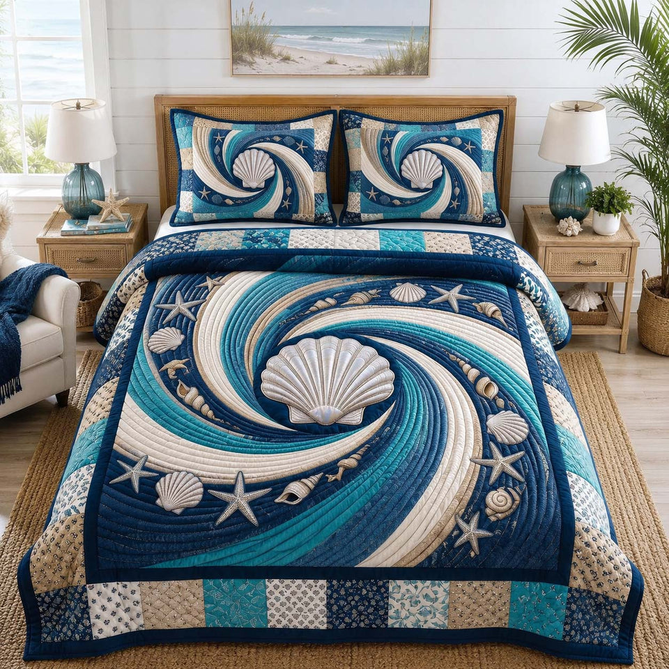 Coastal Whisper Sea quilted bedding set, quilt and two pillow shams on a made bed