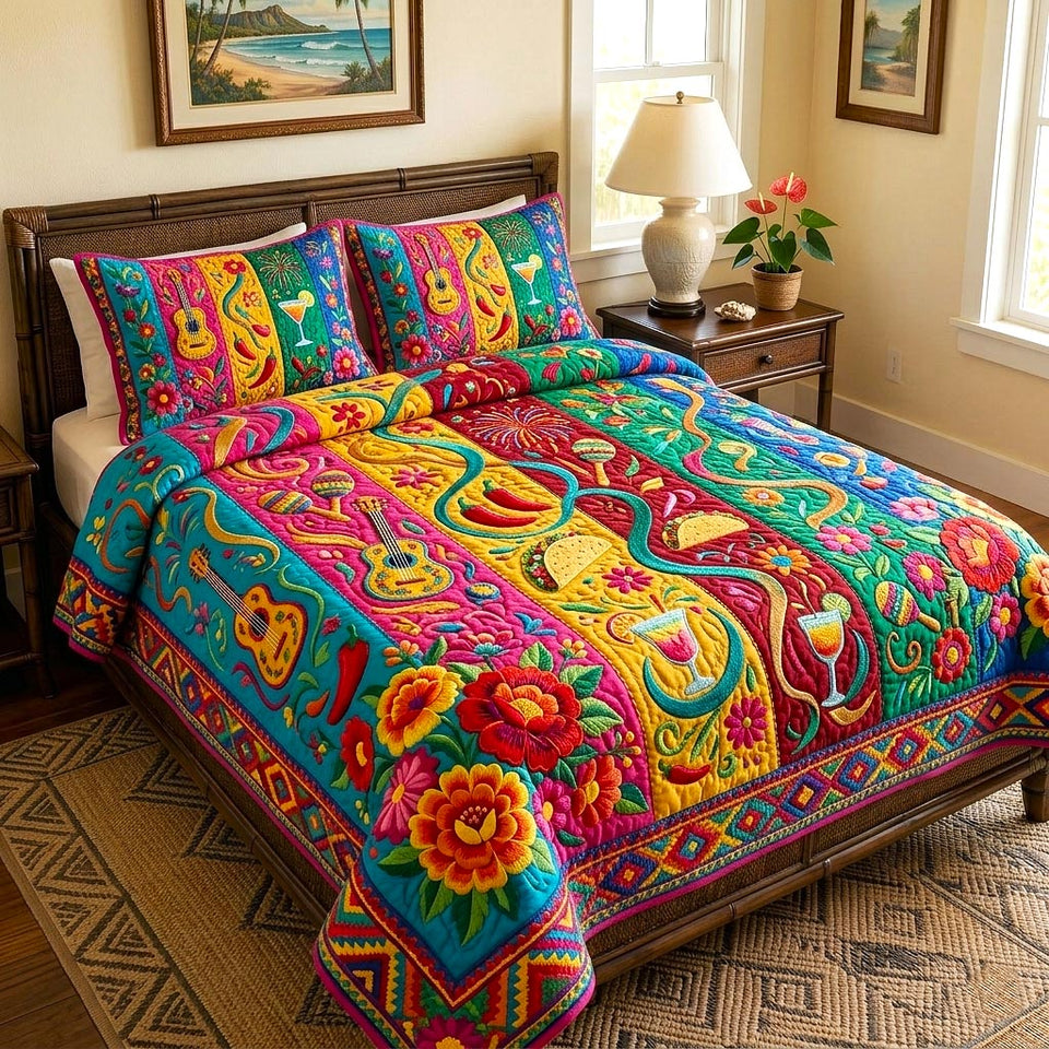 Colorful Fiesta quilted bedding set, quilt and two pillow shams on a made bed