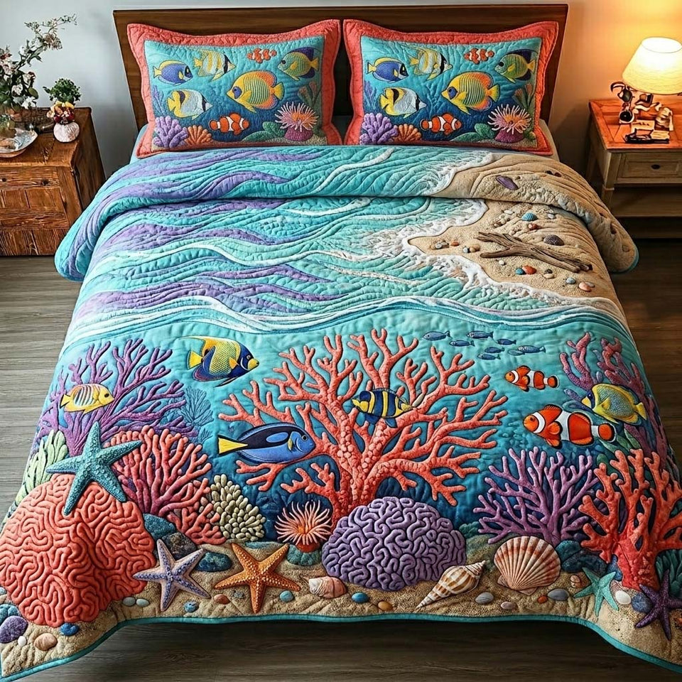 Coral Reef Rainbow Tide quilted bedding set, quilt and two pillow shams on a made bed