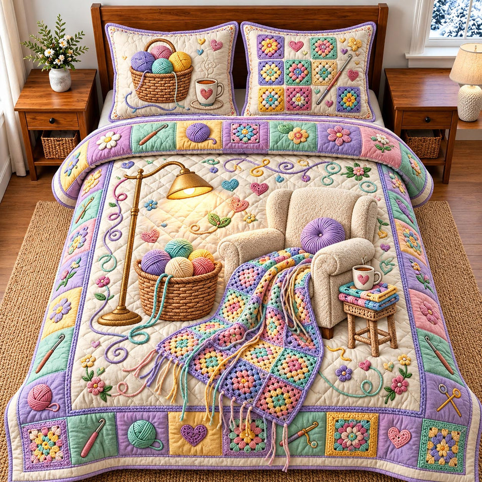 Cozy Crochet Room quilted bedding set, quilt and two pillow shams on a made bed