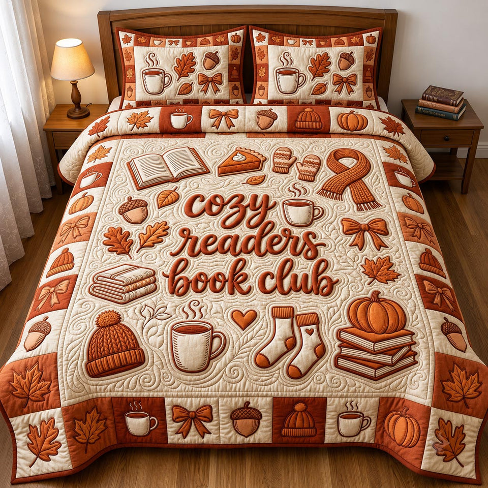 Cozy Readers Book Club quilted bedding set, quilt and two pillow shams on a made bed