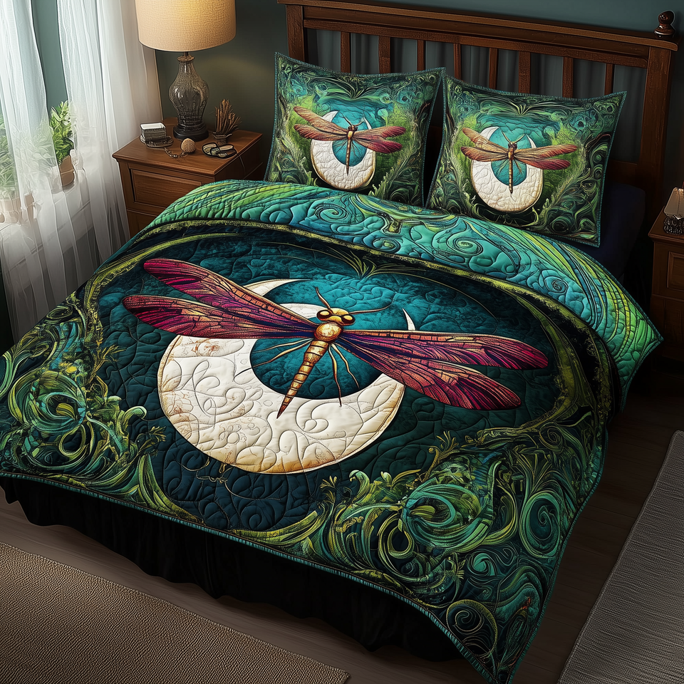 Dragonfly and Crescent Moon Magenta Wings quilted bedding set, quilt and two pillow shams on a made bed