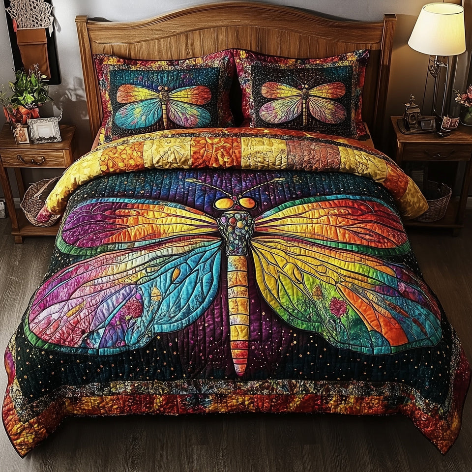 Dragonfly Dream Rainbow Wings On Dark Patchwork quilted bedding set, quilt and two pillow shams on a made bed