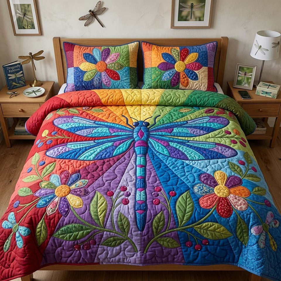Dragonfly in Rainbow Blooms quilted bedding set, quilt and two pillow shams on a made bed