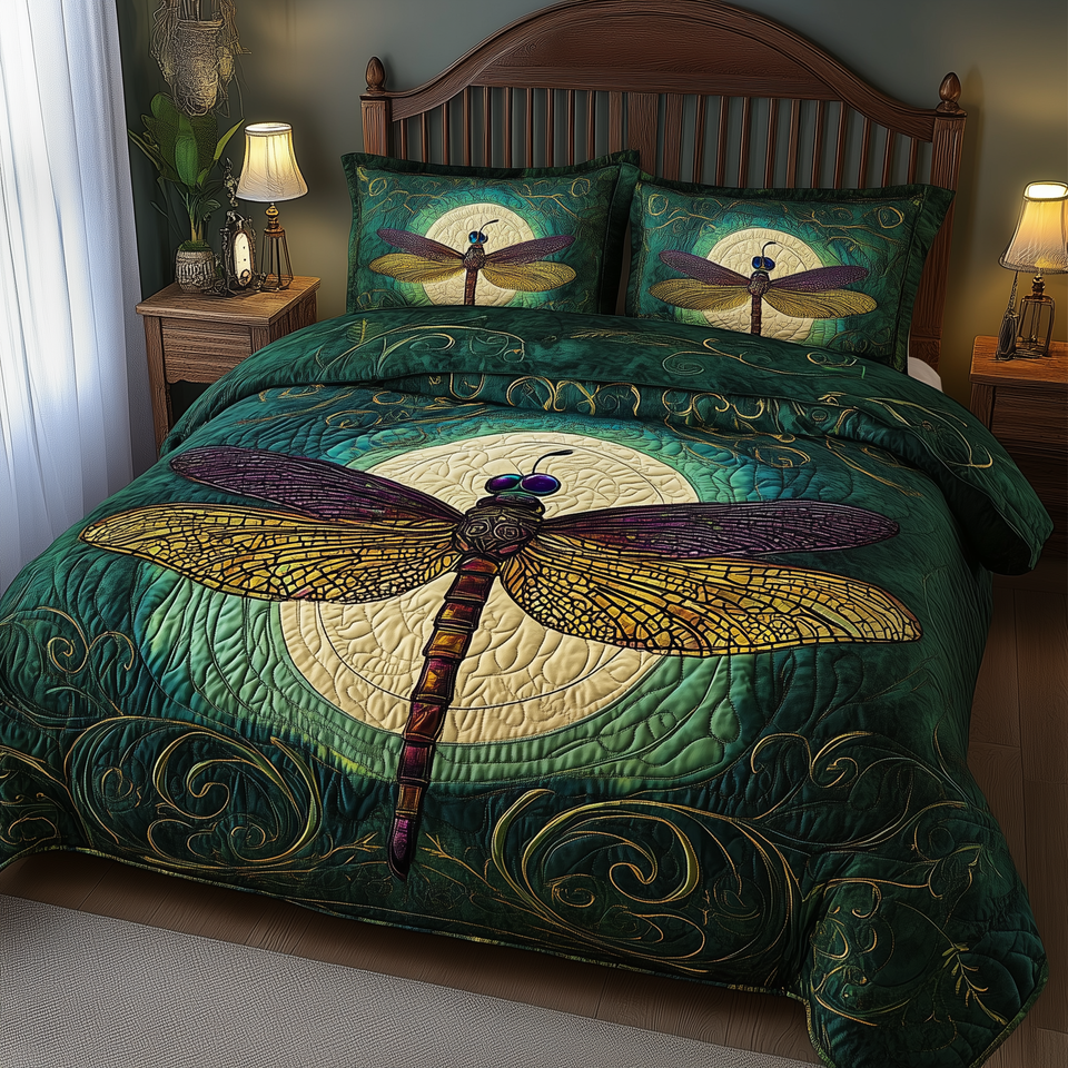 Dragonfly Mandala Golden Crescent Moon quilted bedding set, quilt and two pillow shams on a made bed