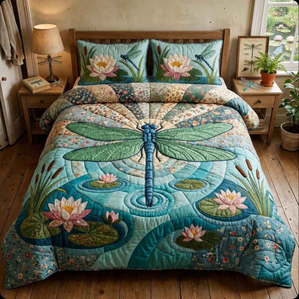 Dragonfly over the Lily Pond quilted bedding set, quilt and two pillow shams on a made bed