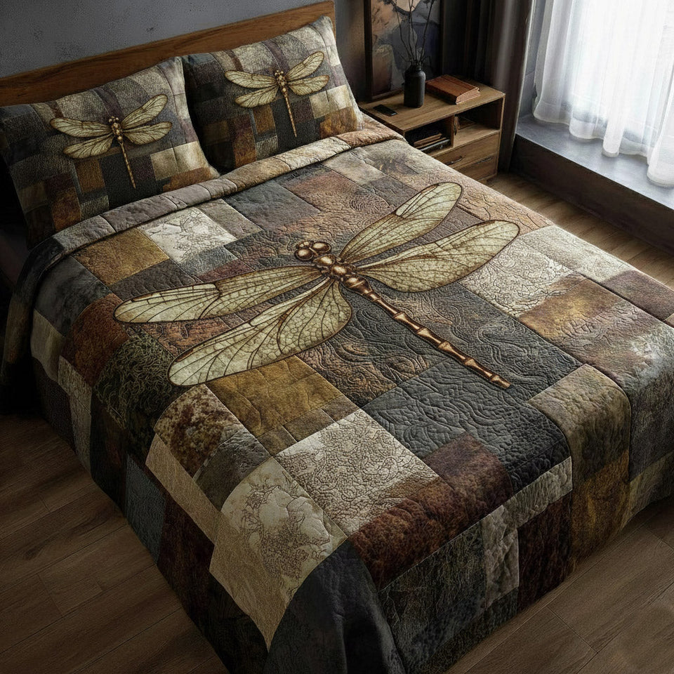 Dragonfly Rustic Patchwork Squares quilted bedding set, quilt and two pillow shams on a made bed