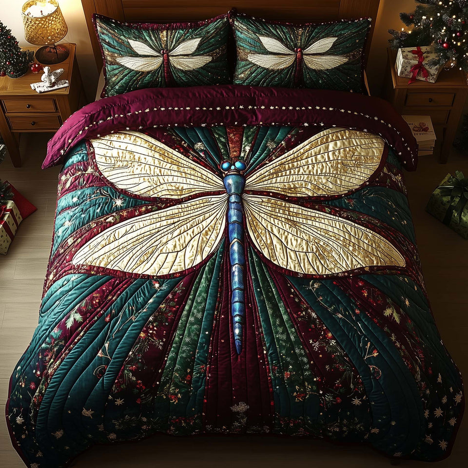Dragonfly Teal Fan Wine Border quilted bedding set, quilt and two pillow shams on a made bed