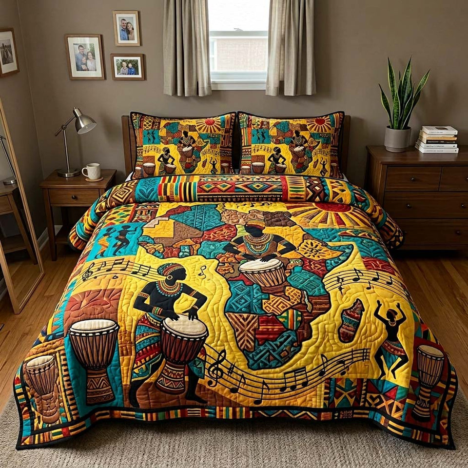 Drum Legacy quilted bedding set, quilt and two pillow shams on a made bed
